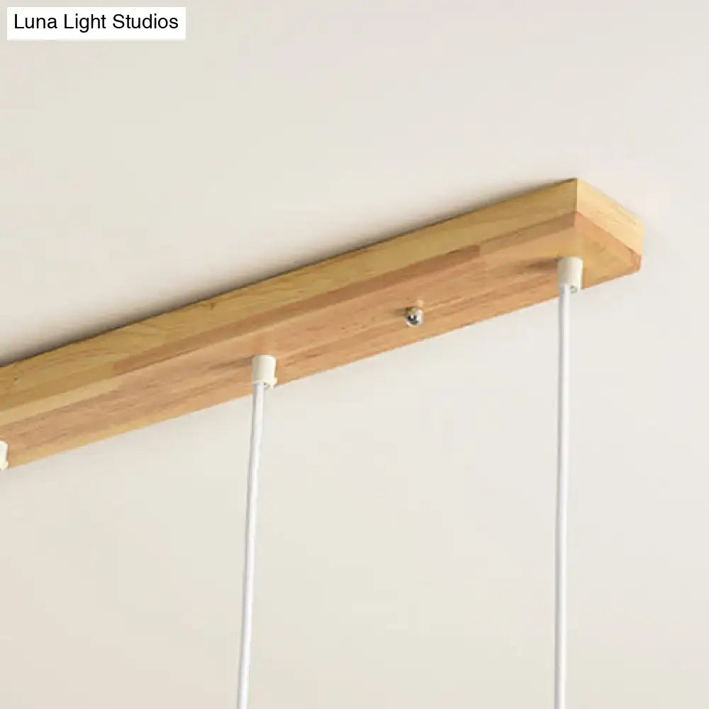 Modern rose gold drum island chandelier with wood dining room light