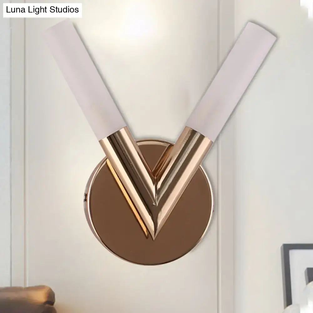 Modern rose gold v-shaped bedroom sconce with white glass shade