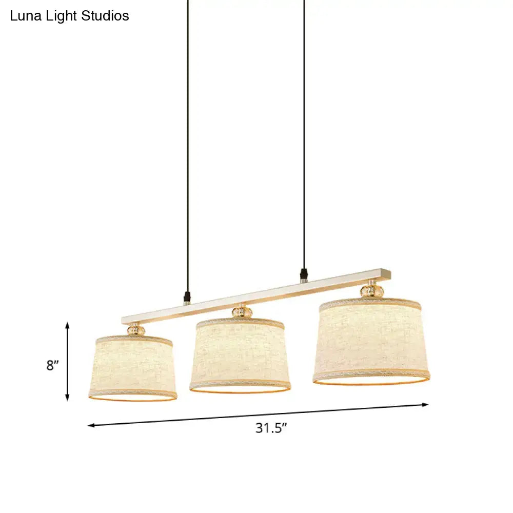 Modern silver and flaxen circle pendant light for kitchen island
