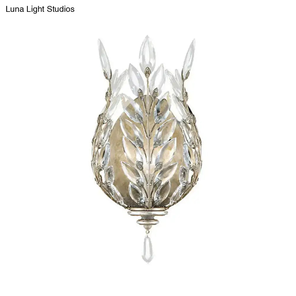 Modern silver & brass laurel wall light with crystal drop bedroom