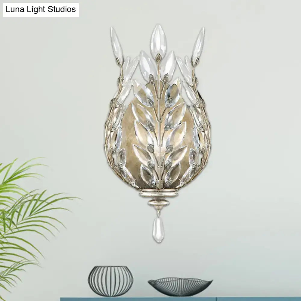 Modern silver & brass laurel wall light with crystal drop bedroom