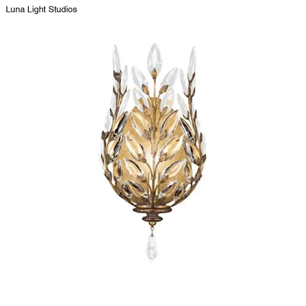 Modern silver & brass laurel wall light with crystal drop bedroom
