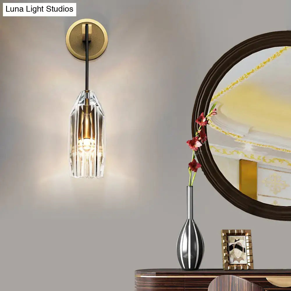 Modern single light brass wall sconce with clear crystal for bedroom