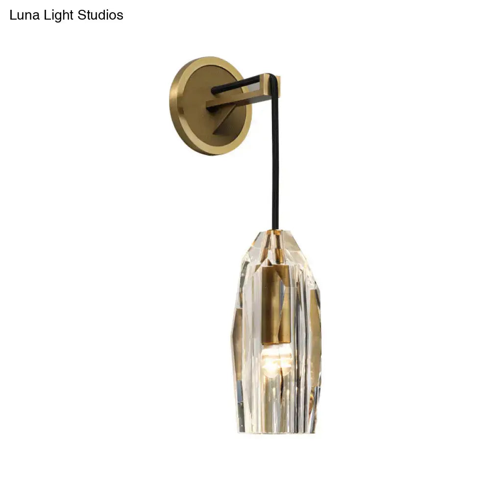 Modern single light brass wall sconce with clear crystal for bedroom