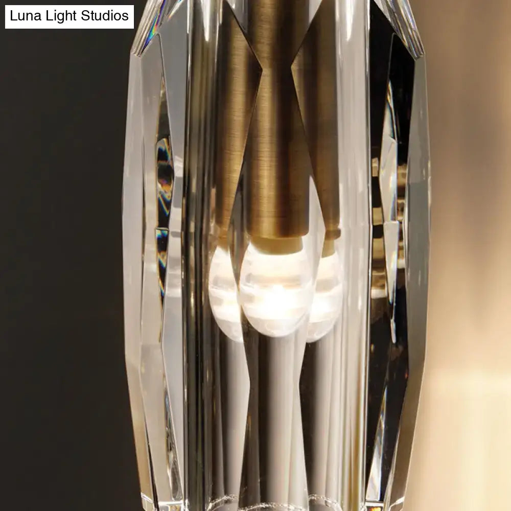 Modern single light brass wall sconce with clear crystal for bedroom