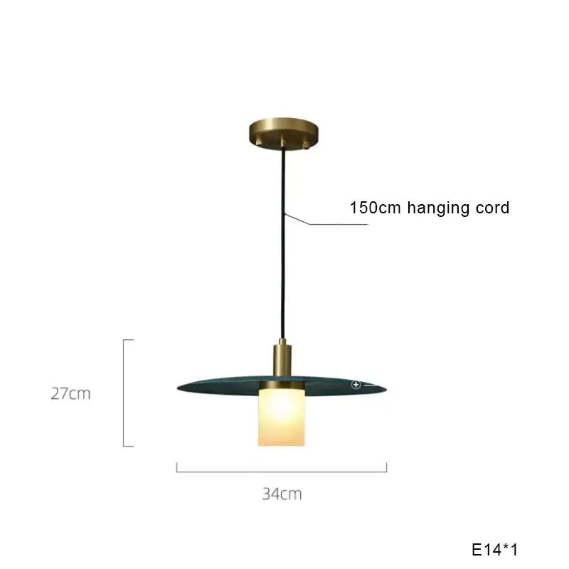 Modern teal glass and brass pendant light for kitchen island
