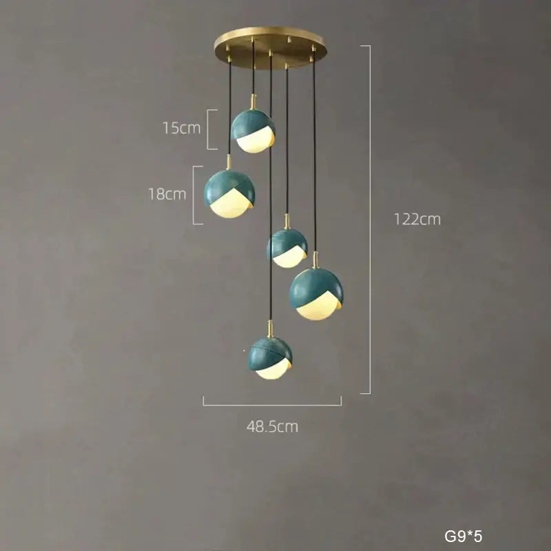 Modern teal glass and brass pendant light for kitchen island