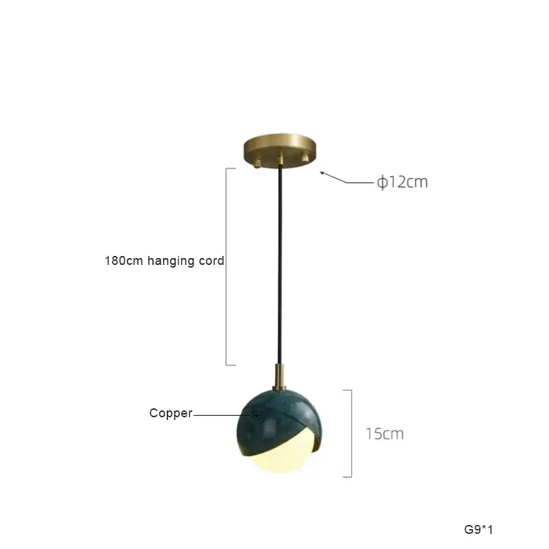 Modern teal glass and brass pendant light for kitchen island