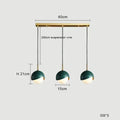 Modern teal glass and brass pendant light for kitchen island