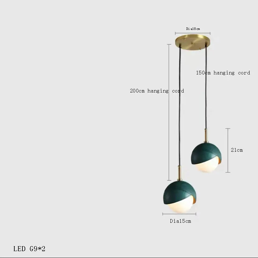 Modern teal glass and brass pendant light for kitchen island