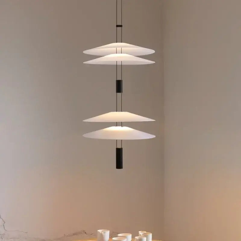 Modern white and black circular pendant light dining room tiered design