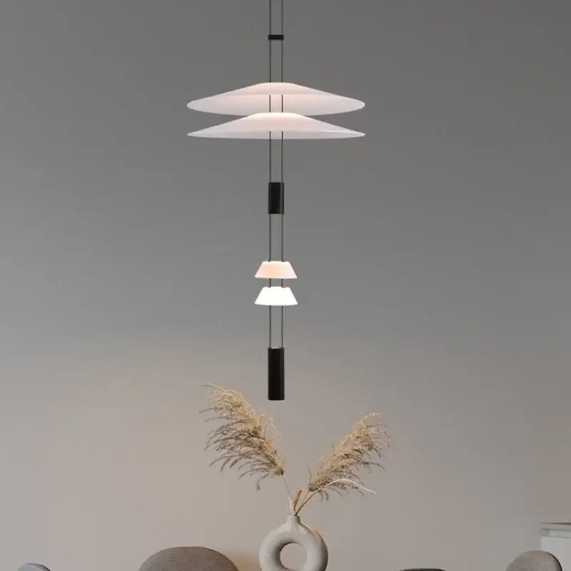 Modern white and black circular pendant light dining room tiered design