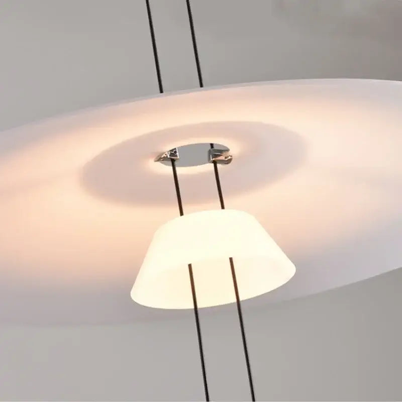 Modern white and black circular pendant light dining room tiered design