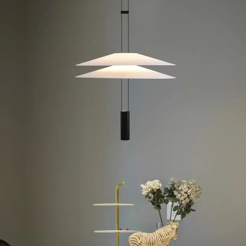 Modern white and black circular pendant light dining room tiered design