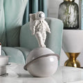 Modern white and gold astronaut phone holder living room figurine