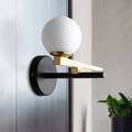 Modern white glass sphere wall light gold & black single light bedroom