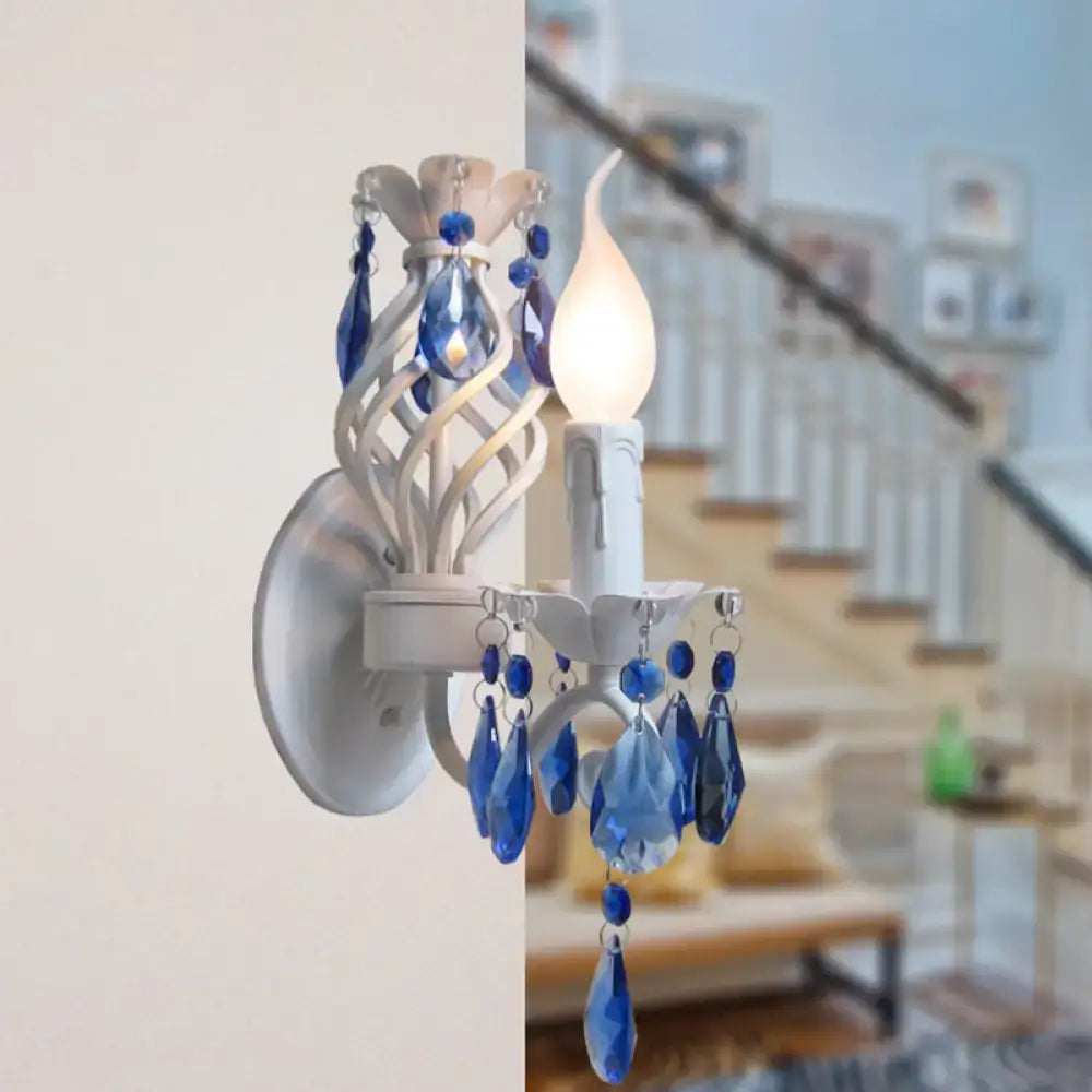Modern white wall light with blue crystal draping bedroom sconce