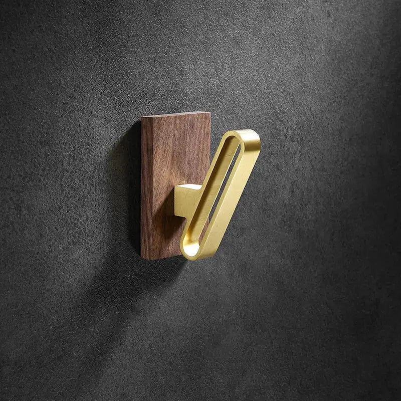 Modern wood and brushed gold wall hook row for kitchen