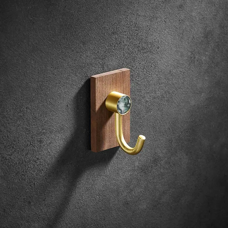 Modern wood and brushed gold wall hook row for kitchen