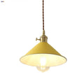 Modern yellow conical pendant light with copper knob for kitchens