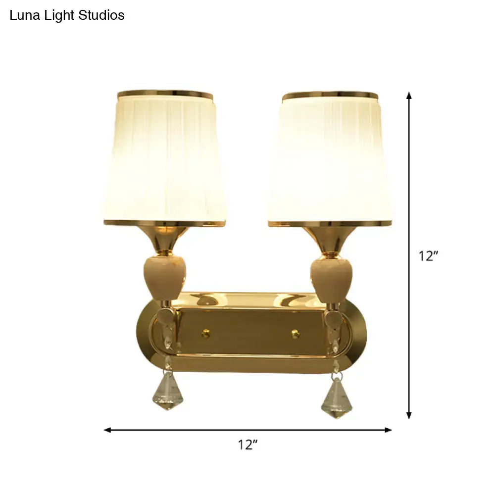 Modernist gold crystal wall sconce with pleated shades living room