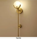 Nordic brass and marble wall lamp for bedroom with frosted glass shade