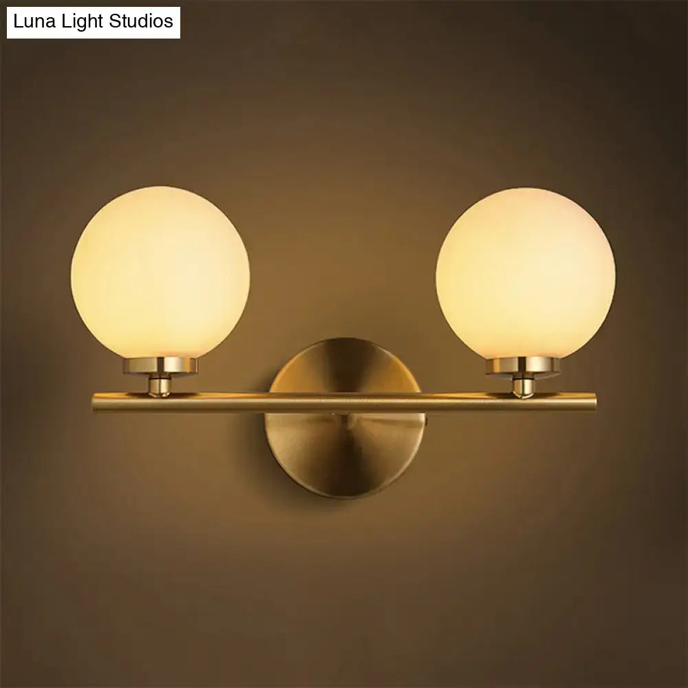 Nordic brass wall sconce light with glass globe – bedroom lighting