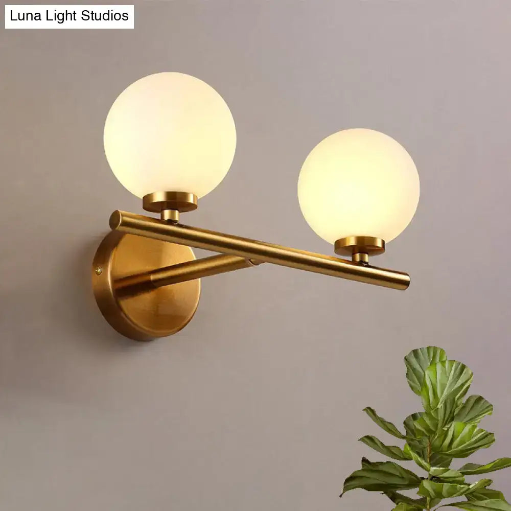 Nordic brass wall sconce light with glass globe – bedroom lighting
