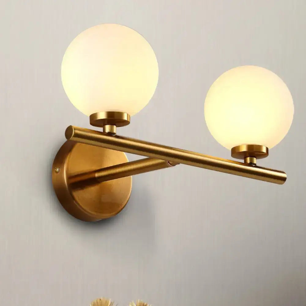 Nordic brass wall sconce light with glass globe – bedroom lighting