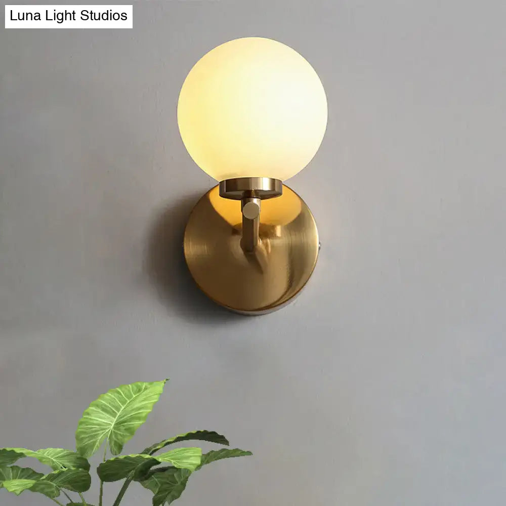 Nordic brass wall sconce light with glass globe – bedroom lighting