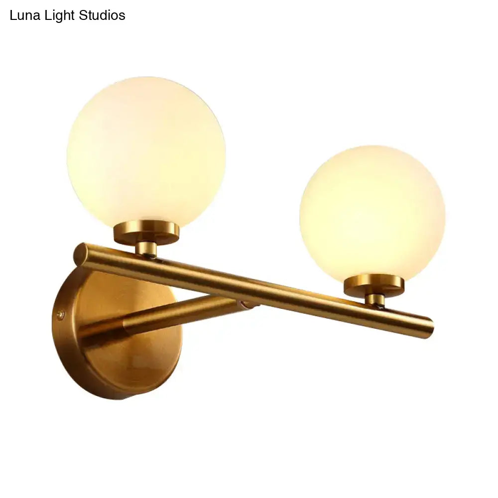 Nordic brass wall sconce light with glass globe – bedroom lighting