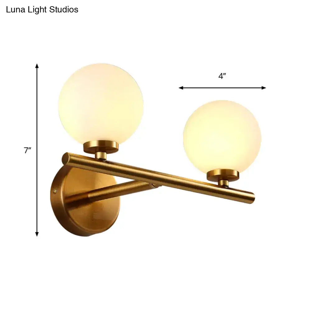 Nordic brass wall sconce light with glass globe – bedroom lighting