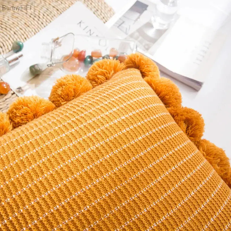 Orange textured ball cushion cover with pompoms living room decor