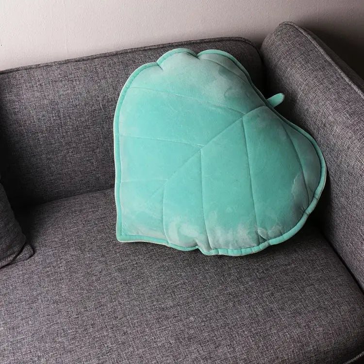 Plush leaf shaped throw pillows in sage and mustard for living room