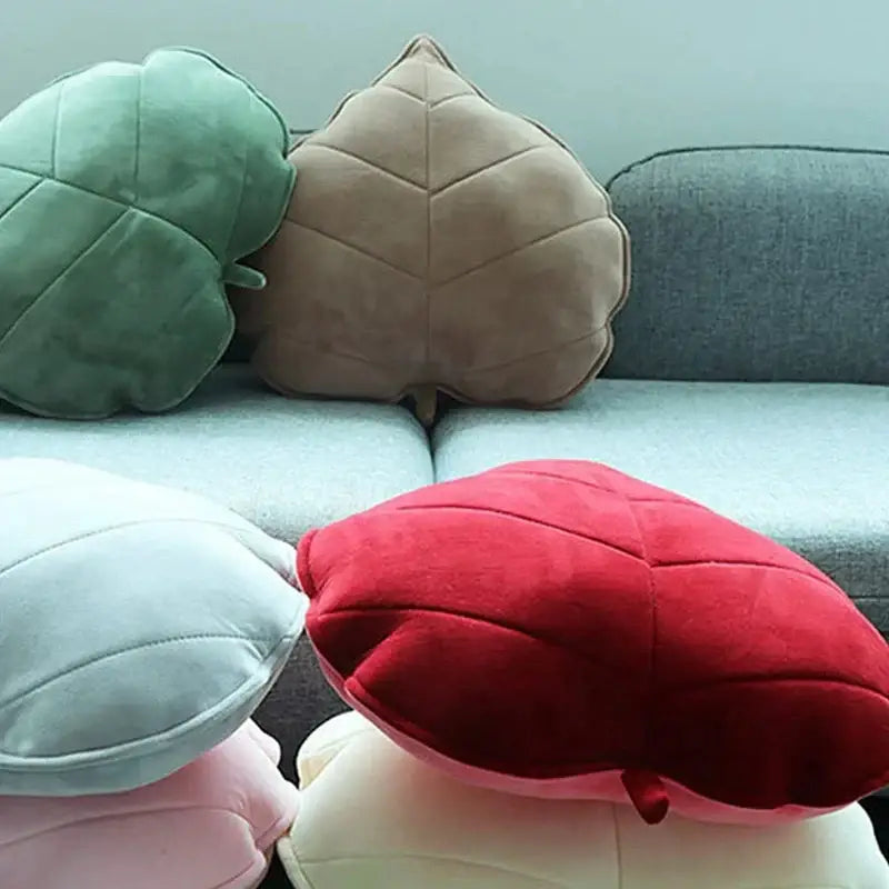 Plush leaf shaped throw pillows in sage and mustard for living room