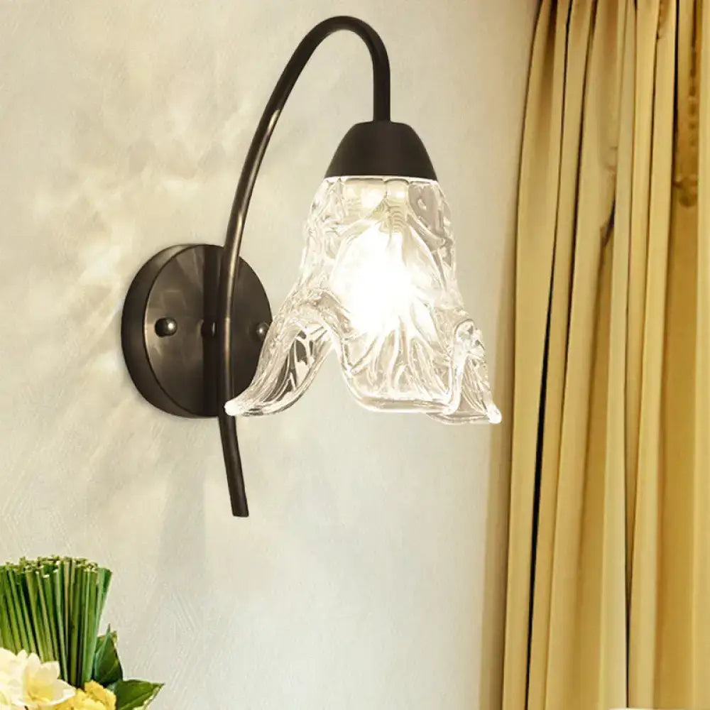 Post-modern black metal wall sconce with clear crystal shade bedroom