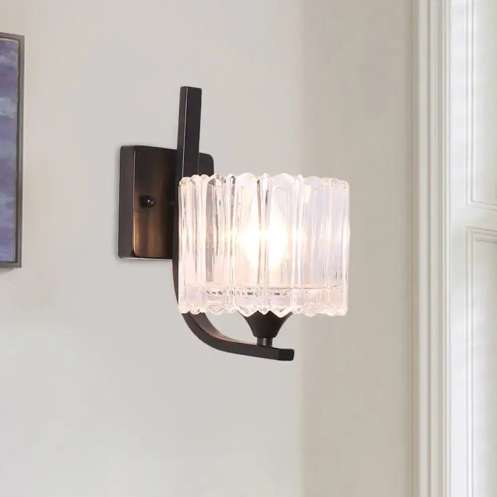 Post-modern black metal wall sconce with clear crystal shade bedroom