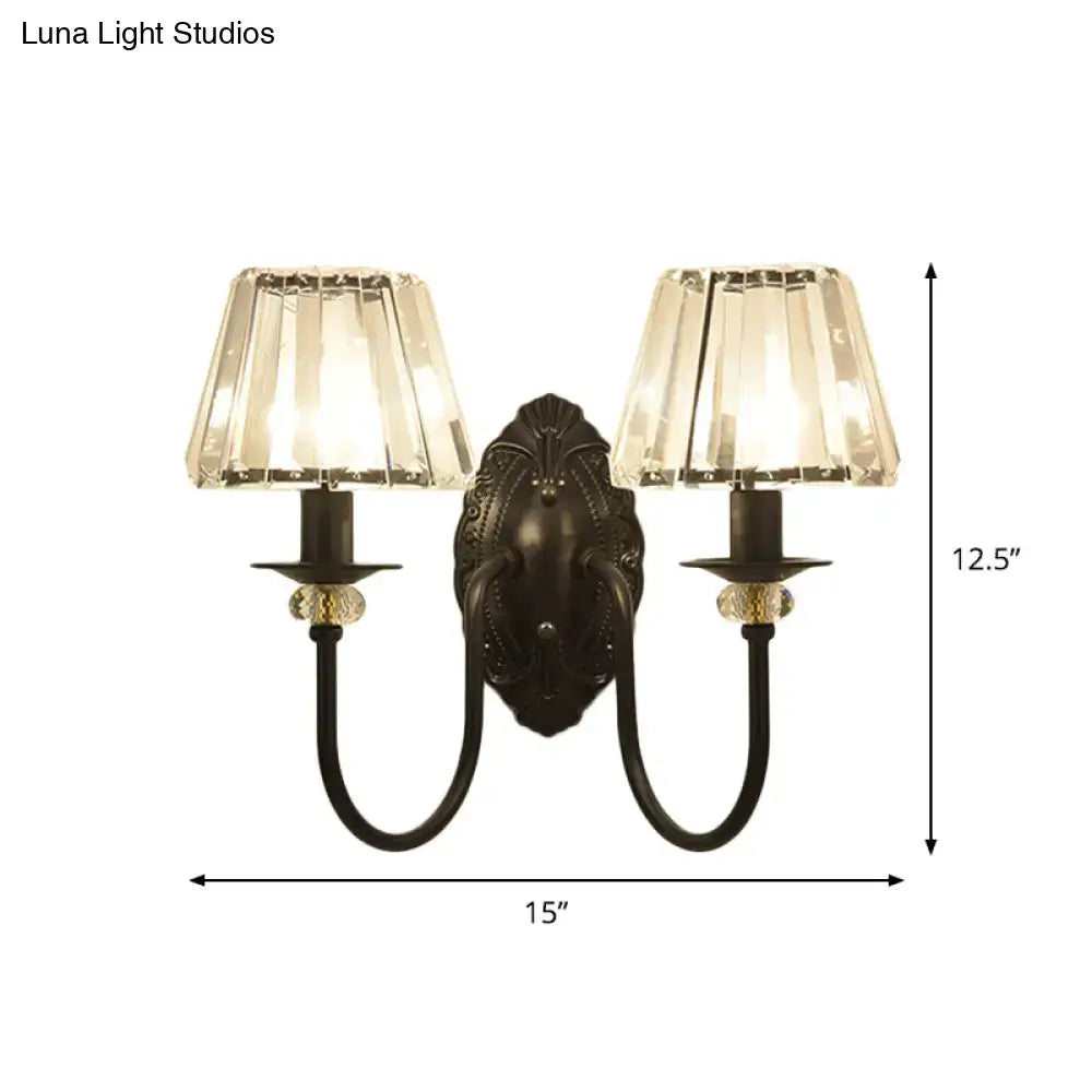 Post-modern black metal wall sconce with clear crystal shade bedroom