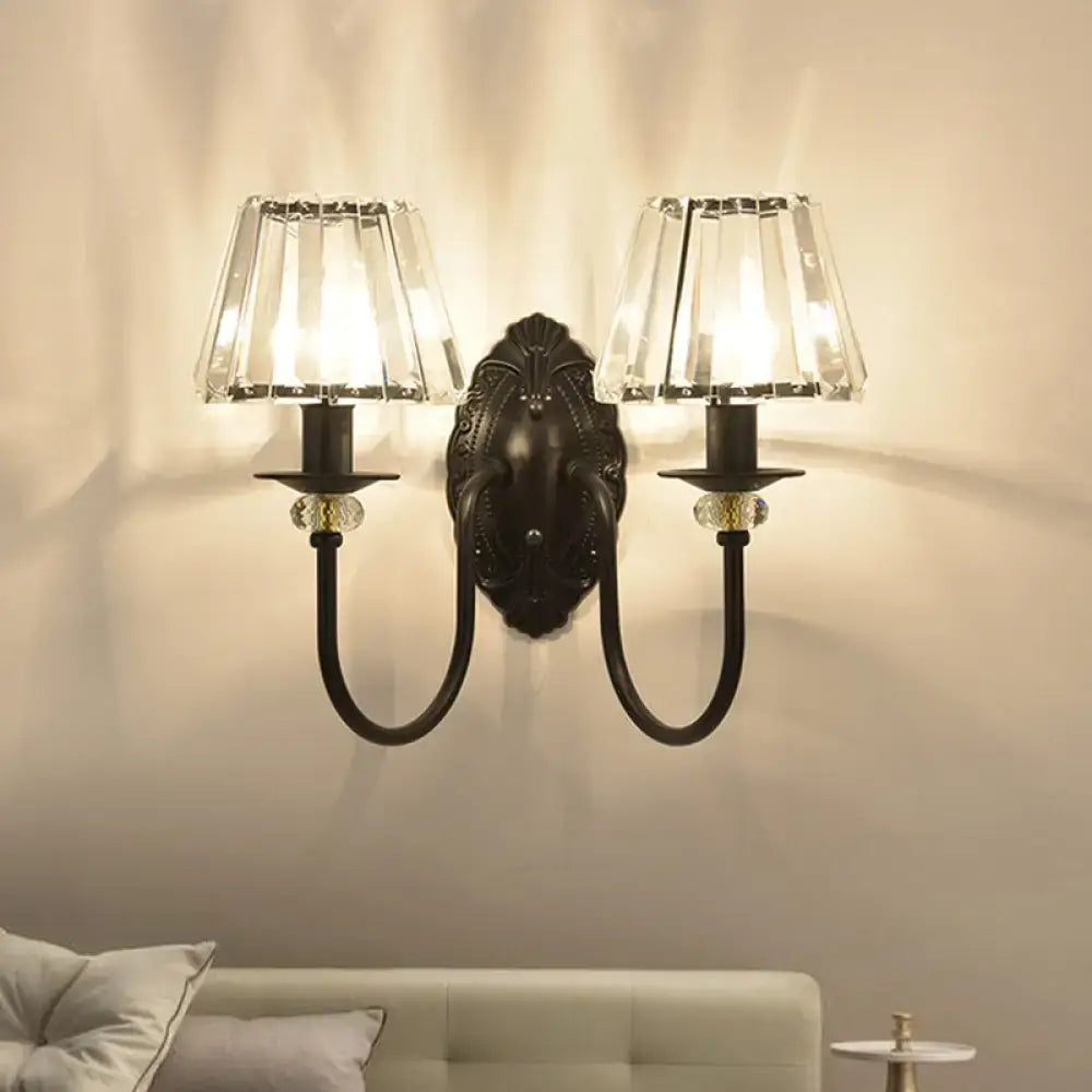 Post-modern black metal wall sconce with clear crystal shade bedroom