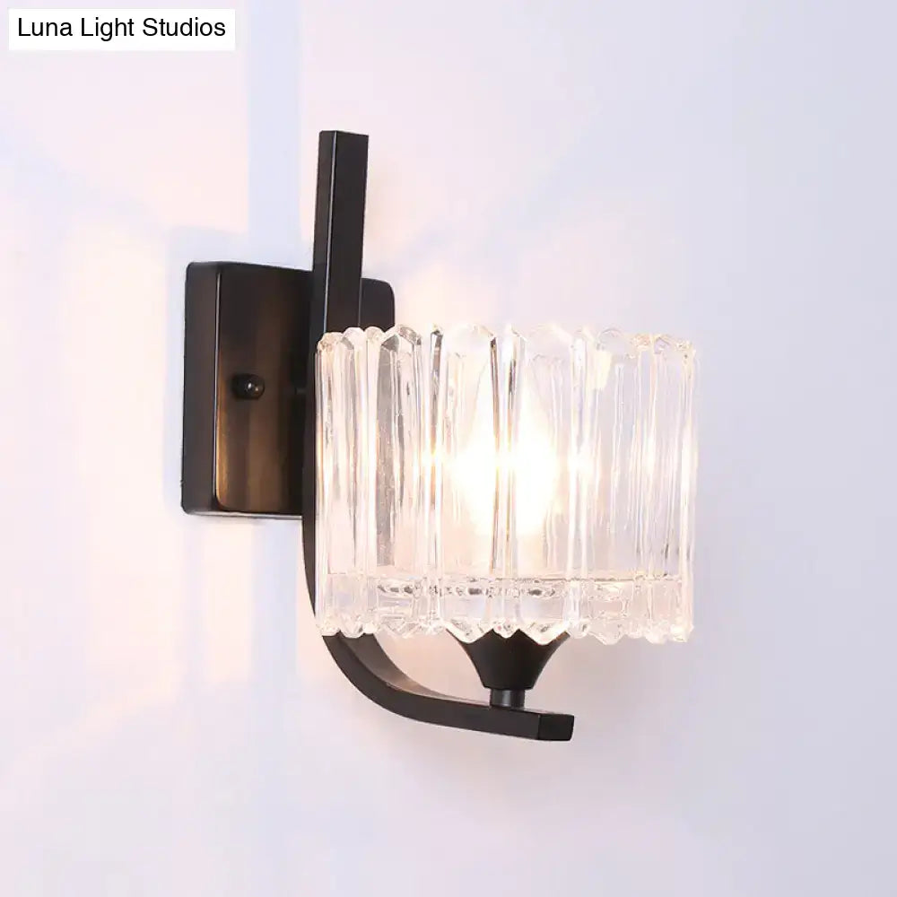 Post-modern black metal wall sconce with clear crystal shade bedroom