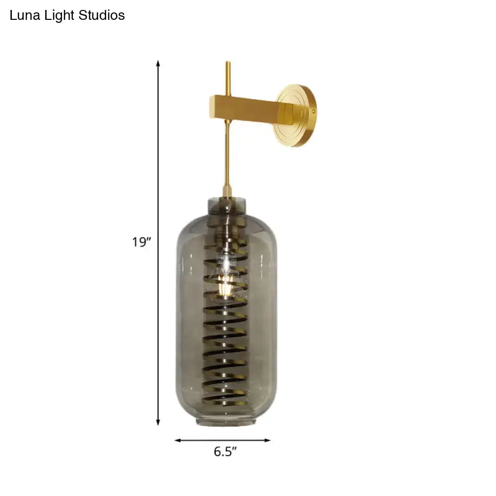 Post-modern brass and smoke gray glass cylinder sconce – bedroom light