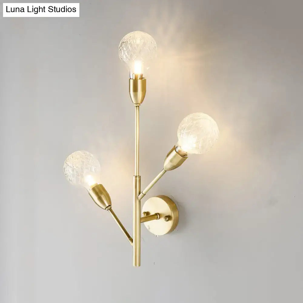 Post-modern brass wall light fixture with clear lattice glass bedroom