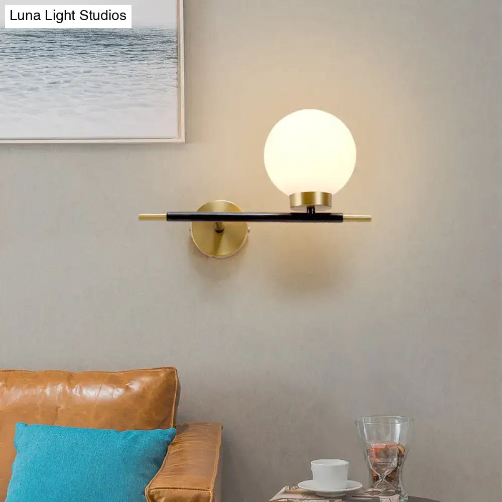 Post-modern white and brass sphere wall sconce bedroom light
