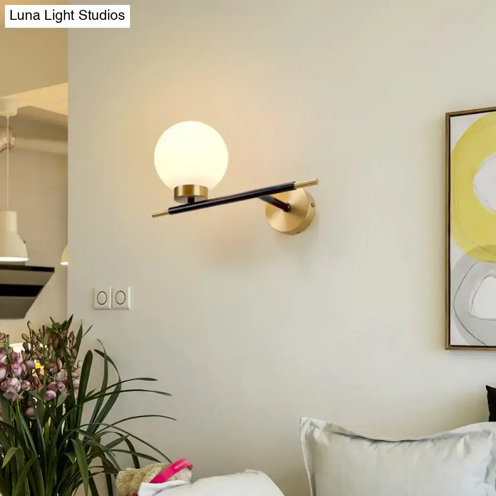 Post-modern white and brass sphere wall sconce bedroom light