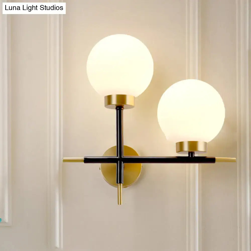 Post-modern white and brass sphere wall sconce bedroom light
