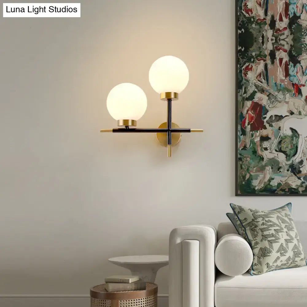 Post-modern white and brass sphere wall sconce bedroom light