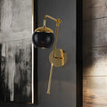 Postmodern black & gold swing arm wall sconce with clear glass bedroom light
