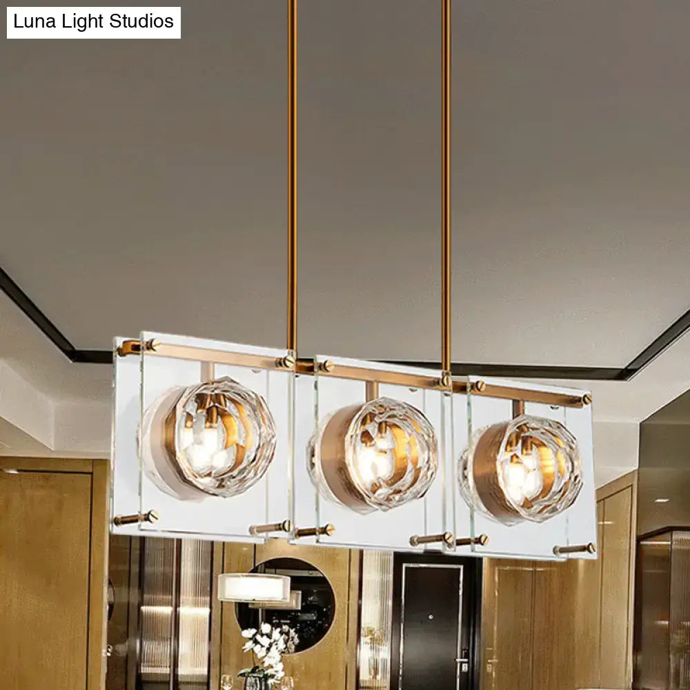 Postmodern gold and clear glass 3-light kitchen island light