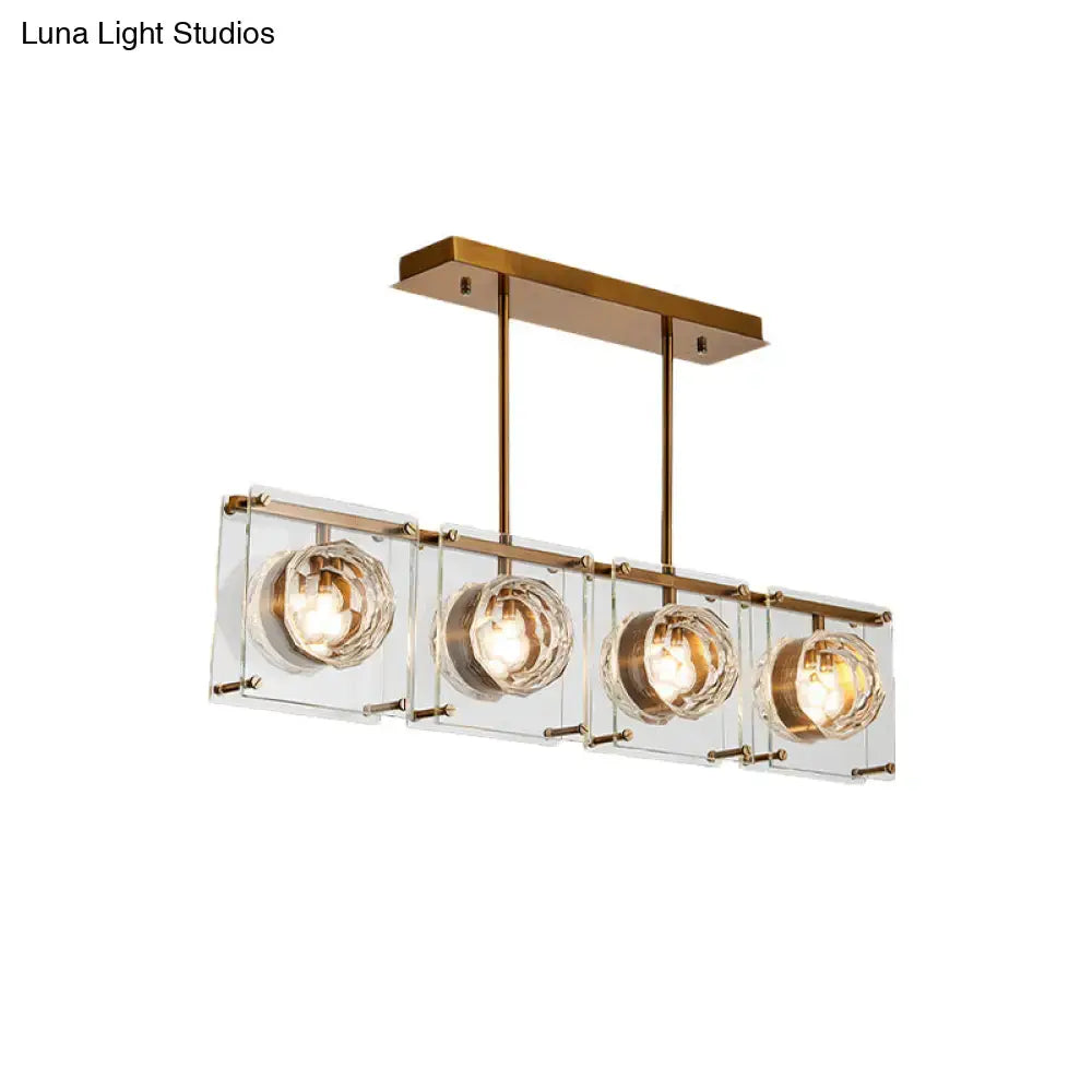Postmodern gold and clear glass 3-light kitchen island light