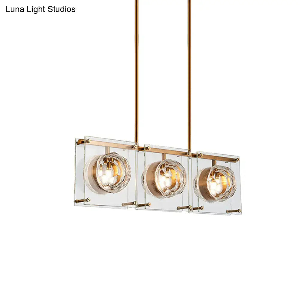 Postmodern gold and clear glass 3-light kitchen island light